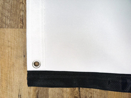 Premium retractable golf impact screen with a durable 3-layer polyester blend, designed to reduce noise, resist pot marks, and prevent burn-in from high-velocity impacts.
