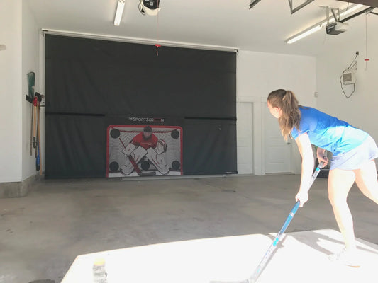 Girl shooting on SportScreen in garage 