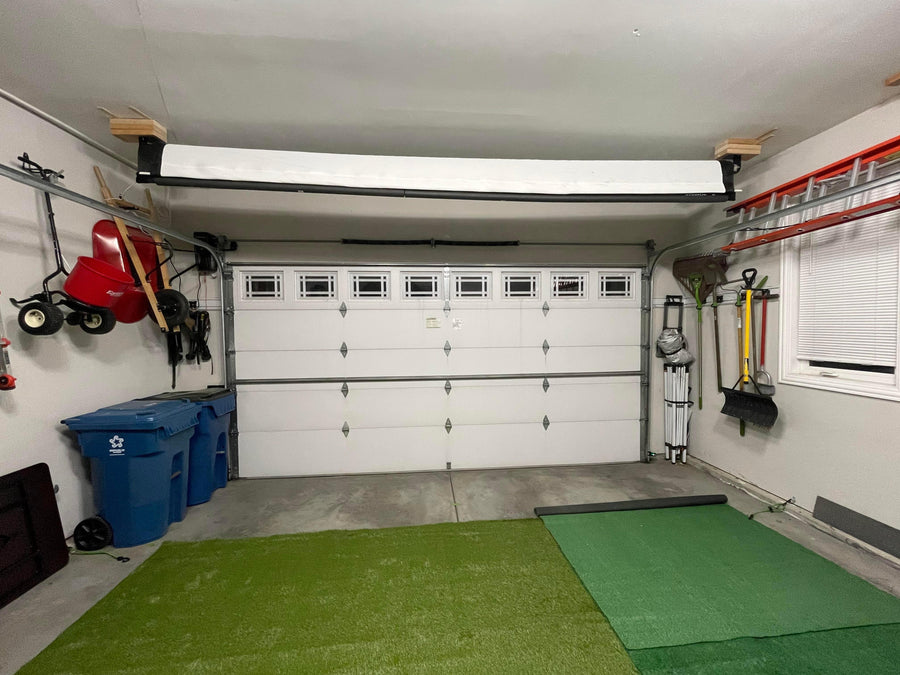 DIY SportScreen retractable impact screen in a garage