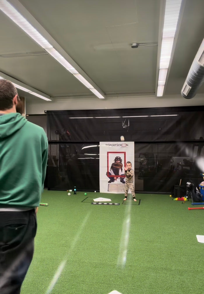 Father and son playing catch on SportScreen