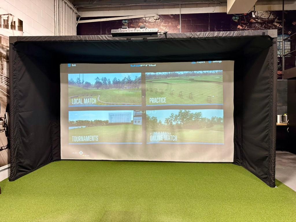 A launch monitor bracket securely mounted to the frame of a golf studio, providing a stable and space-saving setup for accurate swing analysis.
