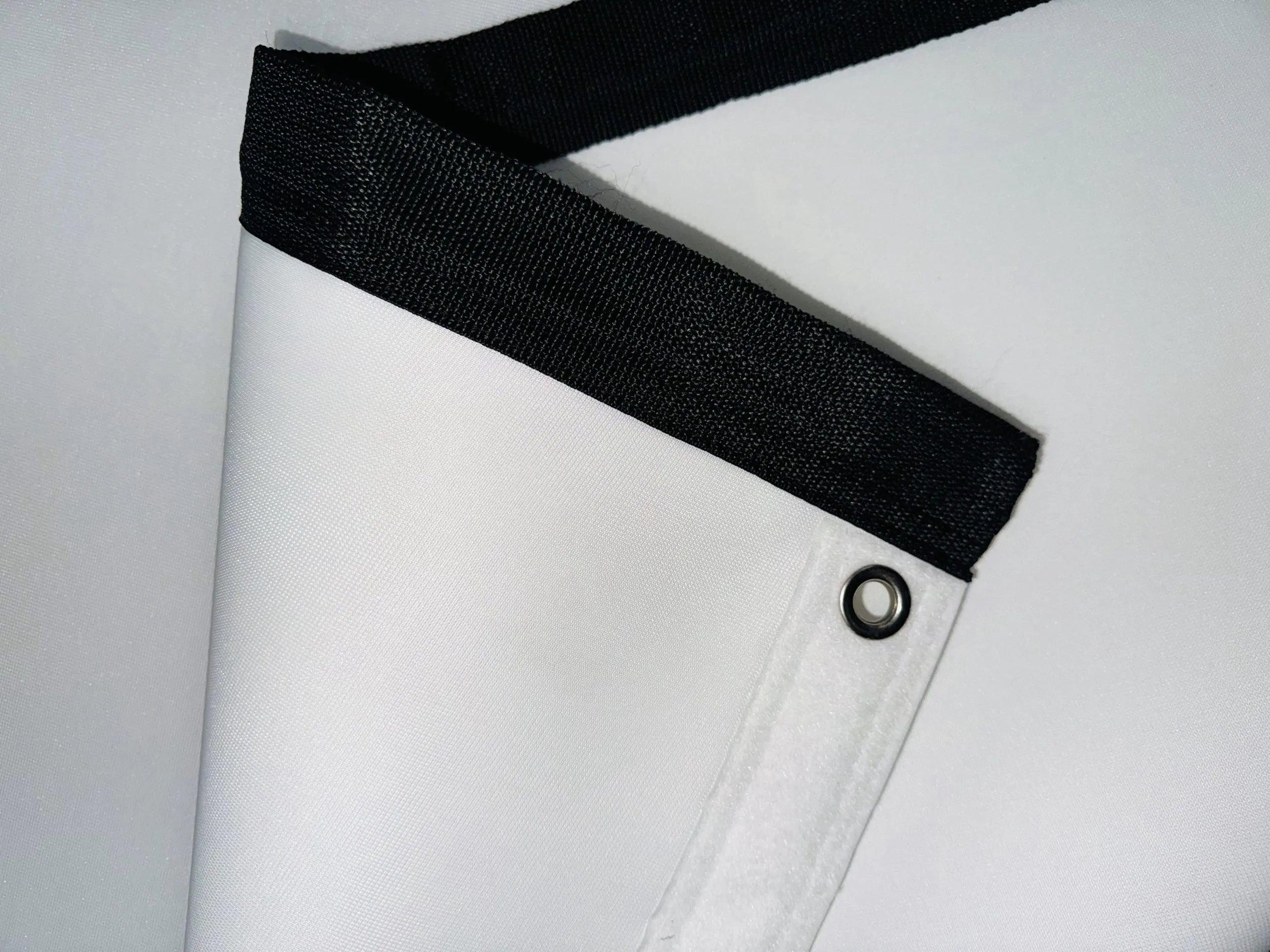 Premium retractable golf impact screen made from a custom 3-layer polyester blend, designed for durability, reduced noise, and resistance to pot marks and burn-in.