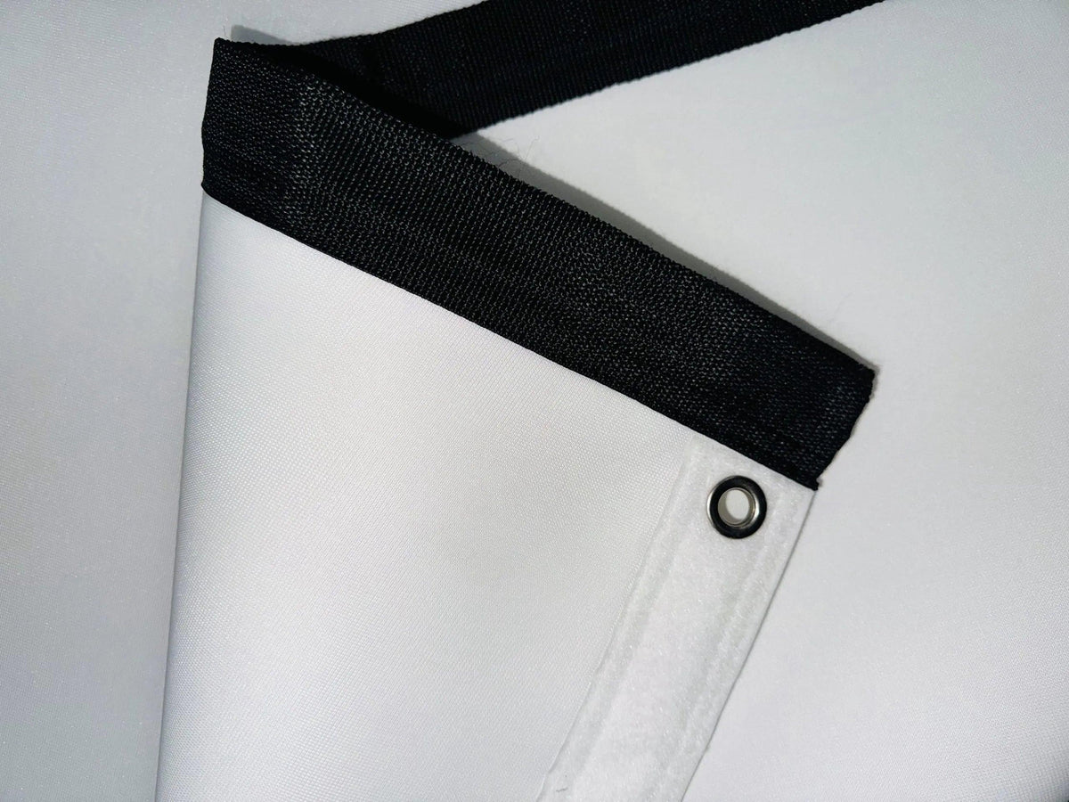 Premium retractable golf impact screen made from a custom 3-layer polyester blend, designed for durability, reduced noise, and resistance to pot marks and burn-in.