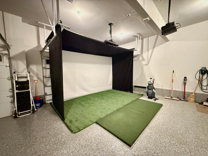 Vanish 11 retracted up in a garage mounted around garage rails with golf bag and turf