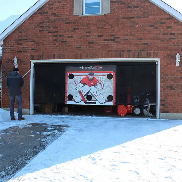 Rolling the SportScreen down with the hand crank for outdoor play