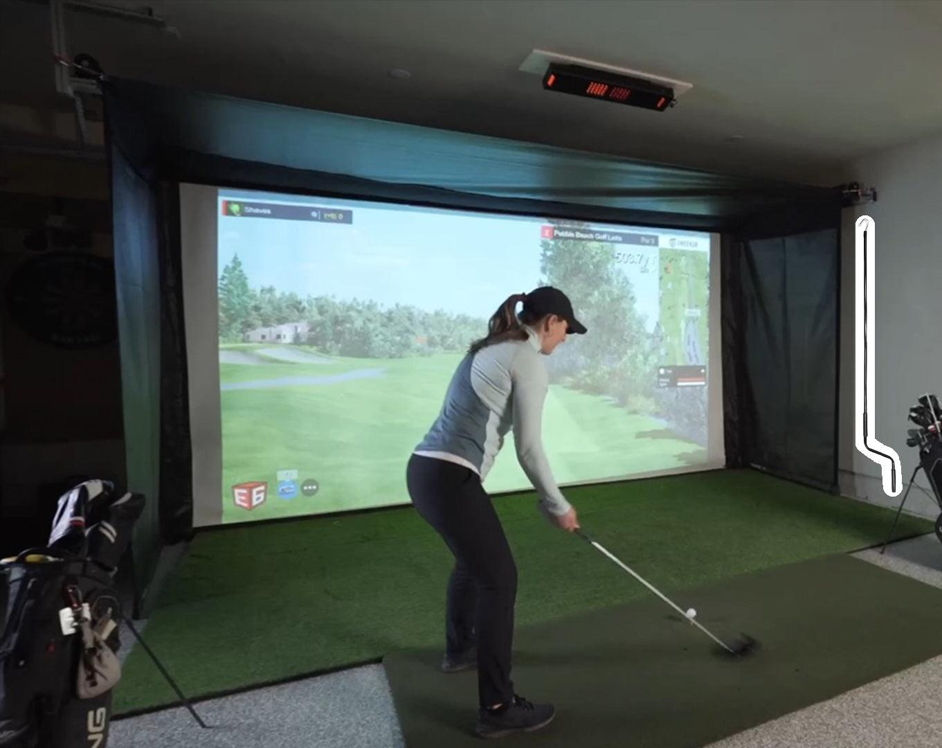 The Vanish Series retractable golf impact screen – a high-end, versatile garage golf studio enclosure with a sleek, roll-up design that easily transforms your space from a professional screen golf setup to an open area.