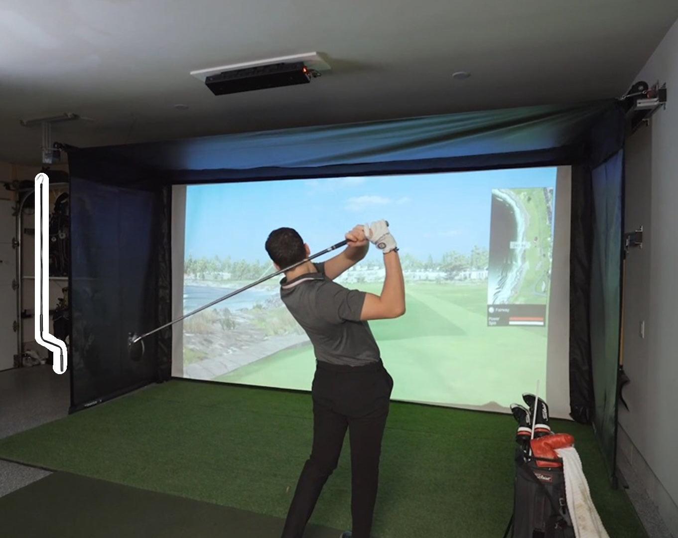 The Vanish Series retractable golf impact screen – a high-end, versatile garage golf studio enclosure with a sleek, roll-up design that easily transforms your space from a professional screen golf setup to an open area.