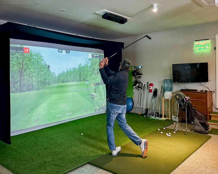 Golfer swinging into Vanish LITE installed in garage